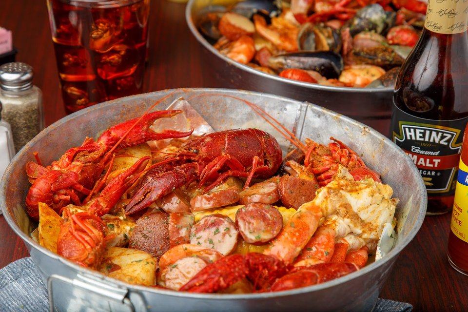 A relaxed seafood restaurant interior with table settings.